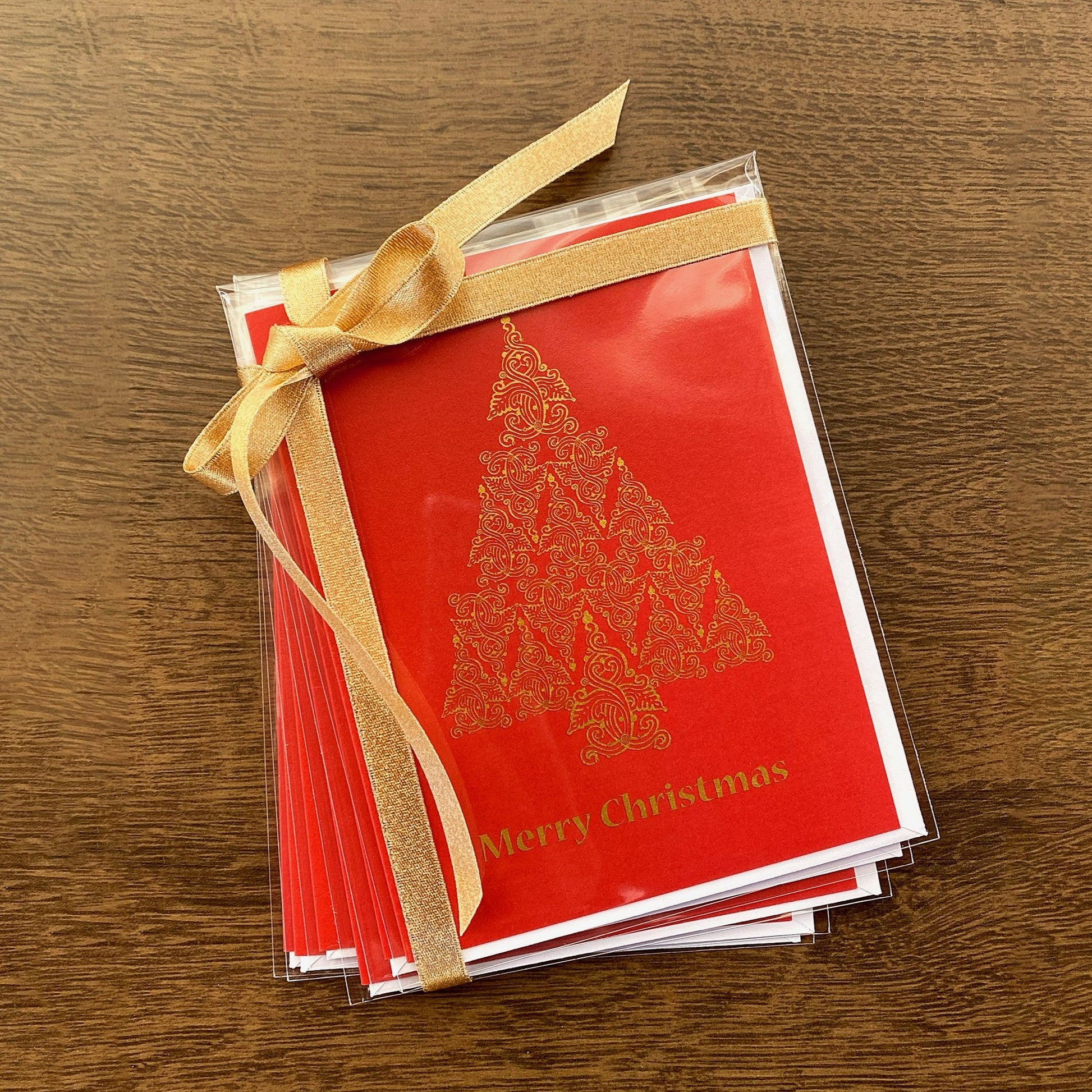 Set of 6 Red Christmas folk tree holiday cards that read "Merry Christmas" and are designed by artist Ariadne Kritonos.